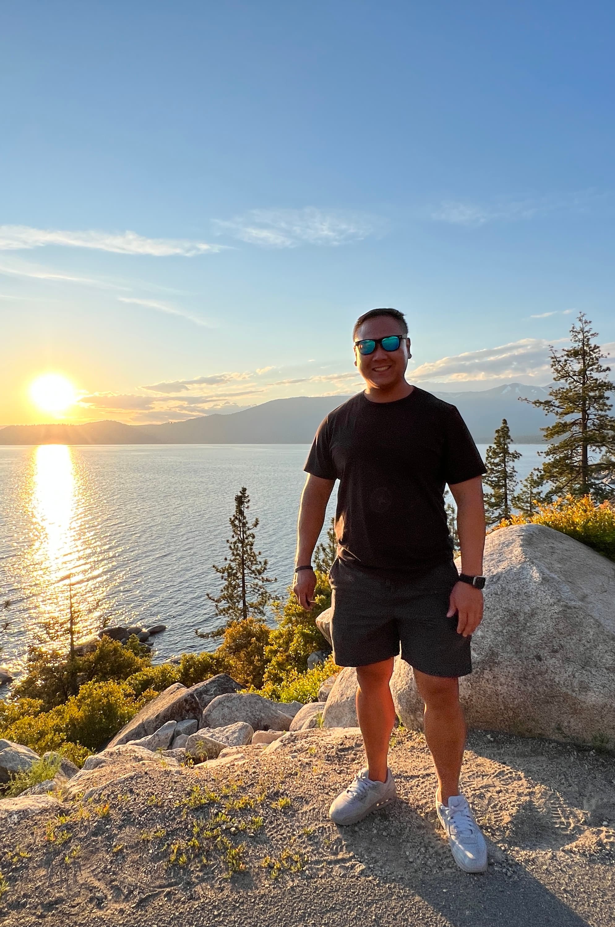 Jeffrey Liu standing at Lake Tahoe at sunset